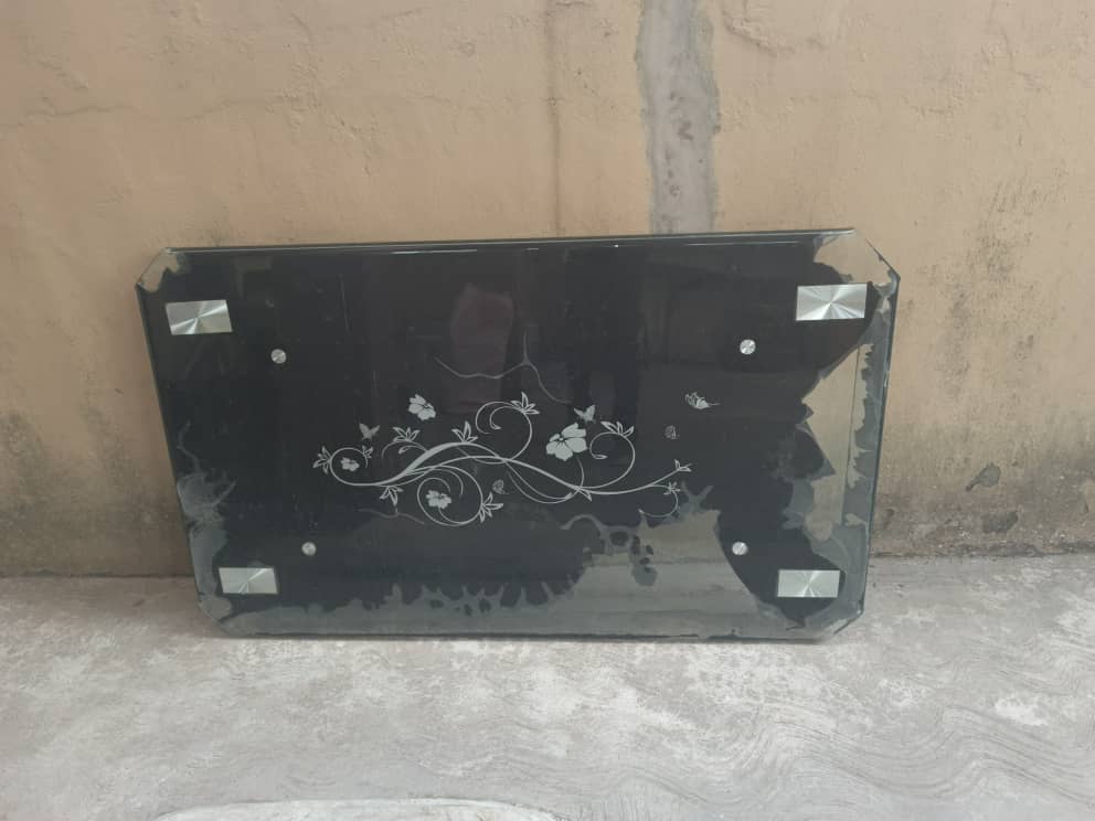 Old rectangular black tempered glass center table